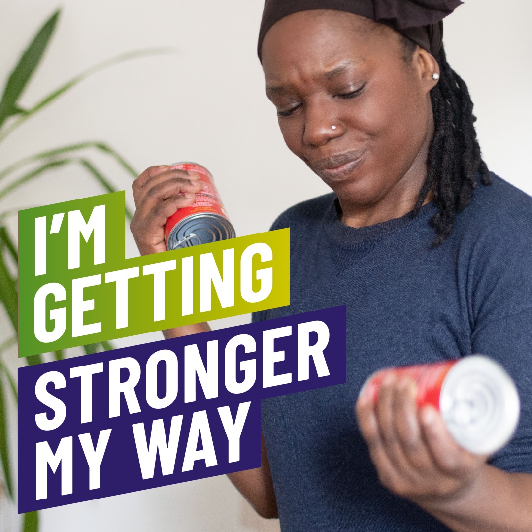 A woman doing some bicep curls using cans