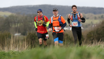 Jon Woods running with two other men